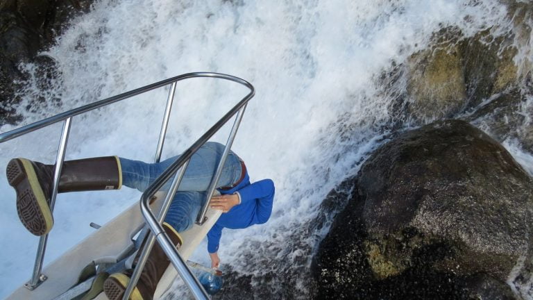 Crew Member risking herself for some Ice Cold Glacier Water.